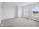 Bedroom featuring plush carpet, closet, and natural light from the two windows at 3931 Wren Dr, Brownsburg, IN 46112