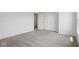 Bedroom with neutral carpet, closet with bi-fold doors, and natural light at 3931 Wren Dr, Brownsburg, IN 46112