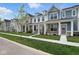 Street view of townhomes with well-kept lawns at 3931 Wren Dr, Brownsburg, IN 46112