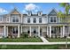 Charming townhome showcasing a well-manicured lawn and a welcoming front porch at 3931 Wren Dr, Brownsburg, IN 46112