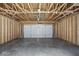 Unfinished garage with concrete floor and exposed framing at 3931 Wren Dr, Brownsburg, IN 46112
