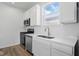 Close-up of kitchen with stainless steel appliances, white cabinets and countertops at 3931 Wren Dr, Brownsburg, IN 46112