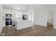 Open kitchen with stainless steel appliances, a center island, and view of the living area at 3931 Wren Dr, Brownsburg, IN 46112