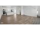Expansive living area flowing into the modern kitchen with stainless steel appliances at 3931 Wren Dr, Brownsburg, IN 46112