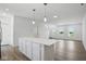 Open living room with a view of the staircase, and bright windows at 3931 Wren Dr, Brownsburg, IN 46112