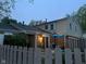 Townhouse backyard with wooden privacy fence, patio dining set, and manicured garden at 3984 Braddock Rd, Indianapolis, IN 46268