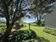 Beautiful backyard featuring mature trees, lush greenery, and a serene outdoor space at 409 Parkway St, Whiteland, IN 46184