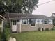 Home with a clean white door and a backyard, ready for renovation and personalized touches at 409 Parkway St, Whiteland, IN 46184