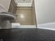 Low angle view of the remodeled bathroom with dark tiled floor and earth toned shower at 409 Parkway St, Whiteland, IN 46184