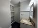 Bathroom vanity has built in shelves, cabinets and a granite countertop at 409 Parkway St, Whiteland, IN 46184