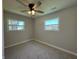 Bedroom featuring neutral walls, plush carpet, and double windows at 409 Parkway St, Whiteland, IN 46184