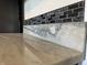 Close up of the luxurious marble-look countertop and mosaic tile backsplash at 409 Parkway St, Whiteland, IN 46184