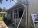 Exterior view showing an in-progress renovation, and ladder offering a chance to customize the space to one's taste at 409 Parkway St, Whiteland, IN 46184