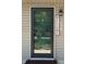 Inviting front door entrance with decorative accents and a welcome sign, creating a warm and inviting first impression at 409 Parkway St, Whiteland, IN 46184