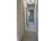 Well-maintained hallway with neutral tones, new flooring, and multiple doors, providing access to other areas of the home at 409 Parkway St, Whiteland, IN 46184
