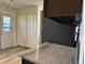 Kitchen featuring marble-look countertops, stainless appliances, and vinyl floors at 409 Parkway St, Whiteland, IN 46184