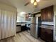 This spacious kitchen is equipped with stainless steel appliances, dark cabinets, and light countertops at 409 Parkway St, Whiteland, IN 46184