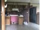 A kitchen showing a unique brick wall and outdated cabinets, providing a canvas for renovation ideas at 409 Parkway St, Whiteland, IN 46184