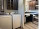 Washer and dryer hookups in combined laundry room and kitchen space at 409 Parkway St, Whiteland, IN 46184