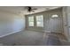 Bright living room featuring ample natural light, neutral walls, and new carpet making the perfect space at 409 Parkway St, Whiteland, IN 46184