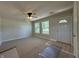 Well-lit living room showcasing new flooring and large windows, creating a spacious and inviting environment at 409 Parkway St, Whiteland, IN 46184