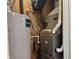 Utility room featuring a water heater and Carrier furnace; essential systems for home comfort and efficiency at 409 Parkway St, Whiteland, IN 46184