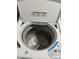 Close up of white washer drum with agitator at 409 Parkway St, Whiteland, IN 46184