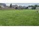Expansive backyard with lush green grass, offering plenty of space for outdoor activities at 4920 E Daisy Ln, Mooresville, IN 46158