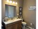 Neutral bathroom with granite countertops, decorated with charming wall art and decorative towels at 4920 E Daisy Ln, Mooresville, IN 46158