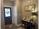 Inviting foyer with decorative console table, warm wall colors, and a welcoming atmosphere at 4920 E Daisy Ln, Mooresville, IN 46158