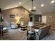 Cozy living room featuring a fireplace, vaulted ceilings, and comfortable seating at 4920 E Daisy Ln, Mooresville, IN 46158