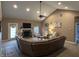 Bright living room showcasing a fireplace, vaulted ceilings, and stylish decor at 4920 E Daisy Ln, Mooresville, IN 46158