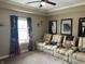 Spacious theater room with tiered seating, perfect for entertaining and enjoying movies at home at 4920 E Daisy Ln, Mooresville, IN 46158