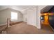 Hallway featuring carpeted floors, a closet, and adjacent bathroom at 5 E Jefferson St, Maxwell, IN 46154