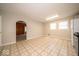 Large kitchen featuring tile flooring, an eat-in area, and access to a den at 5 E Jefferson St, Maxwell, IN 46154