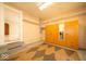 Laundry room with adjacent storage cabinets and a step-up landing at 5 E Jefferson St, Maxwell, IN 46154