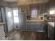 Practical kitchen with gray cabinetry and a convenient layout at 513 Andover Rd, Anderson, IN 46013