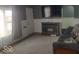 Spacious living room boasting a fireplace and a TV at 513 Andover Rd, Anderson, IN 46013
