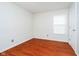 Minimal bedroom with hardwood floors and a window at 5240 Ochs Ave, Indianapolis, IN 46254