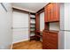 This closet features built-in organizers with shelves, drawers, and multiple rods for storing a variety of items at 5240 Ochs Ave, Indianapolis, IN 46254