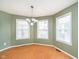 Cozy dining room with hardwood floors and a chandelier at 5240 Ochs Ave, Indianapolis, IN 46254