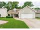Charming single Gathering home with a front porch, lawn, and a two-car garage at 5240 Ochs Ave, Indianapolis, IN 46254