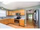 Bright kitchen featuring stainless steel appliances and hardwood floors at 5240 Ochs Ave, Indianapolis, IN 46254
