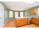 Open-concept kitchen with stainless steel appliances and hardwood floors at 5240 Ochs Ave, Indianapolis, IN 46254