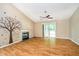 Comfortable living room with hardwood floors, fireplace, and a sliding door at 5240 Ochs Ave, Indianapolis, IN 46254