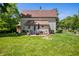 Spacious backyard featuring a patio set, perfect for outdoor relaxation and entertaining at 5253 W 8Th Street Rd, Anderson, IN 46011