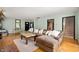 Inviting living room featuring hardwood floors, comfortable seating, and abundant natural light at 5253 W 8Th Street Rd, Anderson, IN 46011