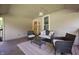Inviting covered porch featuring comfortable seating and a stylish outdoor rug at 5253 W 8Th Street Rd, Anderson, IN 46011
