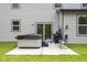 Relaxing backyard patio featuring a hot tub, grill, and comfortable seating area at 5264 Veranda Dr, Noblesville, IN 46062