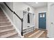 Inviting foyer featuring a coat rack with bench and a view of the front door at 5264 Veranda Dr, Noblesville, IN 46062